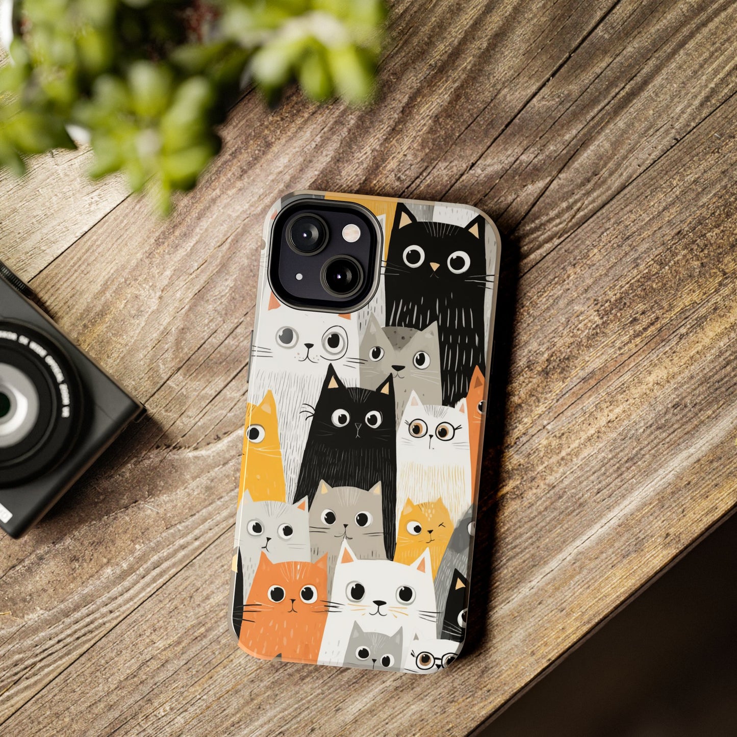Whimsical phone case with a variety of illustrated cats